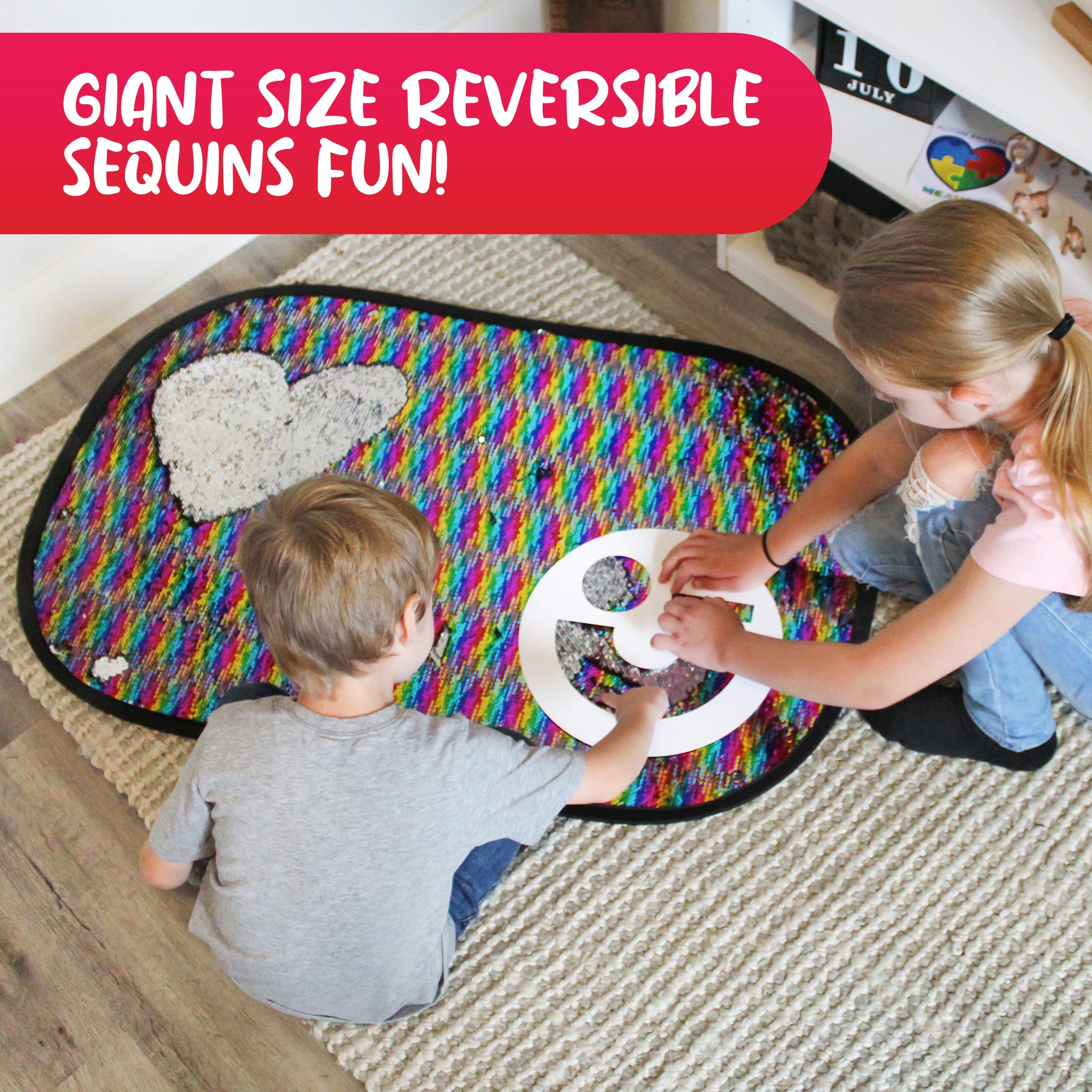 Two children playing with the Giant Reversible Rainbow Sequins Toy and a shape stencil on the floor